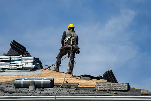 Professional Roof Replacement technician working in Bedford, MA